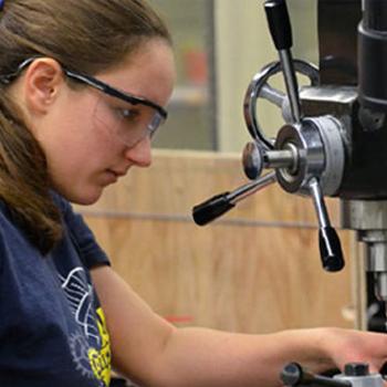 Student using a machine